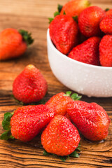 Poster - Bunch of fresh strawberries on wooden board background