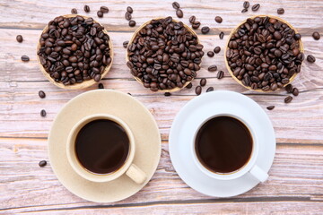 Poster - Top view coffee cup and coffee beans on old wood table background, space for text