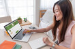 © weedezign - Asian woman order grocery online with laptop at home.new normal digital lifestyle with technology