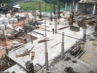 Sticker - KUALA LUMPUR, MALAYSIA -AUGUST 23, 2019: Construction workers working at the construction site in Malaysia during the daytime. They are required to wearing appropriate safety gear to avoid an accident