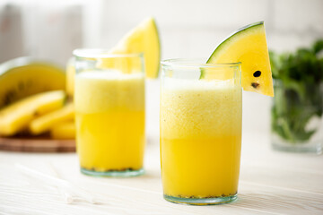 yellow watermelon smoothie in large glasses