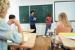 © Yakobchuk Olena - Pupils and tutor during english lesson at school