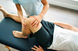 © Louis-Paul Photo - physiotherapist doing treatment with patient in bright office