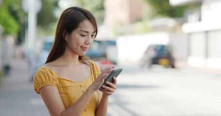 Wall Mural - Woman use of mobile phone for calling taxi