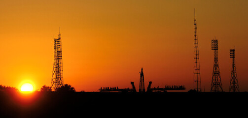 Wall Mural - pre-launch of spaceship in the spaceport. silhouette of space shuttle at dusk. mixed media