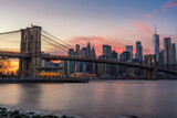 Fototapeta  - Colorful Pink Sunset Behind The Brooklyn Bridge and New York Skyline
