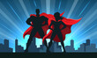 © gertot1967 - Superhero Couple Silhouette with City Skyline Background