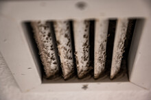 Subjective Focus On Lint And Dirt Particles On A Ceiling Air Vent