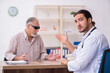 © Elnur - Old blind man visiting young male doctor