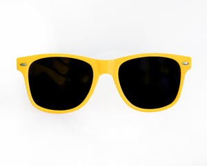 Wall Mural - Yellow sunglasses on white background