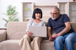 © Elnur - Old couple doing the online shopping