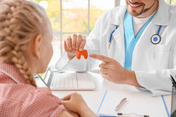 Little girl visiting endocrinologist in clinic