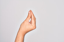 Hand Of Caucasian Young Man Showing Fingers Over Isolated White Background Doing Italian Gesture With Fingers Together, Communication Gesture Movement