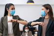 © Kawee - People in office company have elbow greeting during covid pandemic
