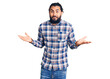 © Krakenimages.com - Young arab man wearing casual clothes clueless and confused expression with arms and hands raised. doubt concept.