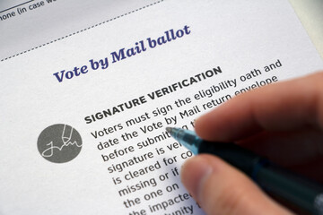Wall Mural - 'Signature Verification' Mail Voting info and hand with pen