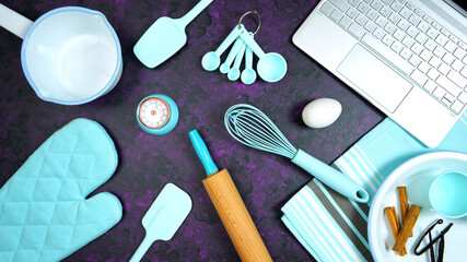 Wall Mural - Cooking baking food theme desktop workspace with laptop on stylish purple textured background. Top view blog hero header creative composition flat lay. Stop motion animation.