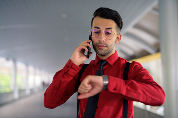 Wall Mural - Young handsome Persian businessman exploring the city