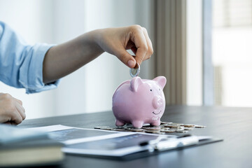 Woman putting coin into piggy bank, step up start up business to success, Saving money for future plan and retirement fund concept