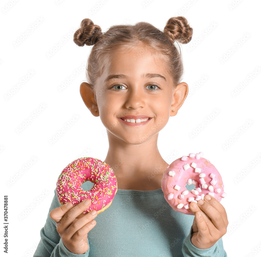 Funny little girl with donuts on white background