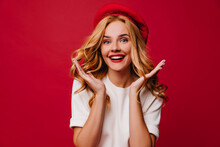 Appealing Happy Woman Posing In French Beret. Studio Shot Of Attractive Fair-haired Girl.