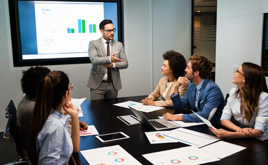 Portrait of successful business team working in office