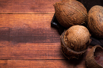 Wall Mural - Open coconut on a wooden table top view