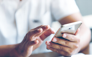 Closeup of a man hand using a smartphone