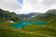 © taidundua - Alpine mountain lake landscape and view, blue beautiful and amazing lake panorama