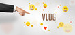 © ra2 studio - Close-Up of cropped hand pointing at VLOG inscription, social media concept