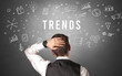 © ra2 studio - Rear view of a businessman with TRENDS inscription, modern business concept