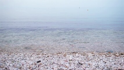 Wall Mural - Pebble beach and blue sky on background