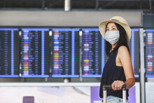 New Normal Travel Of Traveler Asian Woman With Mask Using Mobile Phone In Airport Thailand