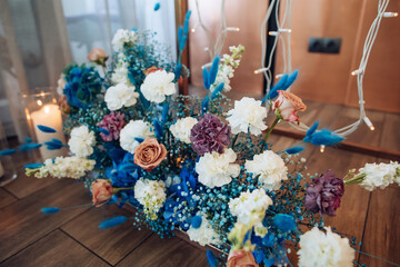 Poster - Bouquet of fresh white hydrangeas, roses, orchids on the wedding arch in the restaurant. Wedding decor