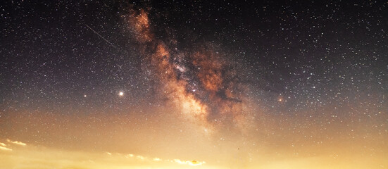 Wall Mural - Beautiful starry sky with bright milky way galaxy. Night landscape. Astronomical background.