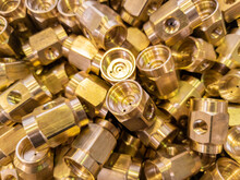Shiny Brass Parts Background, Chaotic Disorder Pile In Close-up View With Selective Focus And Dreamy Blur