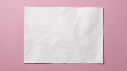 Wall Mural - white crumpled paper texture on pink background. stop motion animation. seamless loop. you can combi