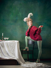 Cocktail, Glass Of Wine. Young Woman As Marie Antoinette On Dark Green Background. Retro Style, Comparison Of Eras Concept. Beautiful Female Model Like Classic Historical Character, Old-fashioned.