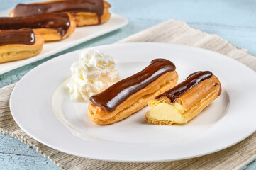 Wall Mural - Eclairs with chocolate topping