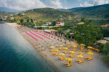 Wall Mural - Sun umbrellas at empty beach in Afissos, Greece