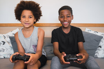 Two brothers playing video games at home.