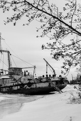 Frozen ship graveyard with two rusty industrial ships