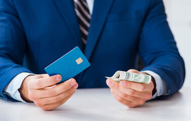 Businessman holding dollar money and credit card