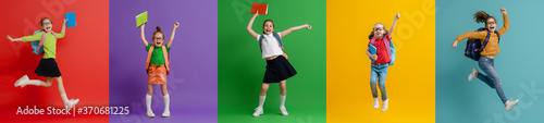 Fotografía Kids with backpacks on colorful background