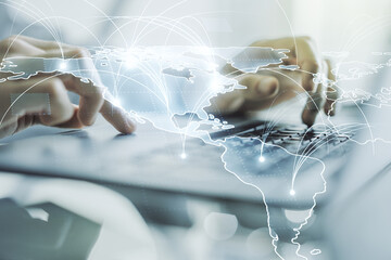 Double exposure of abstract digital world map with connections and hand typing on computer keyboard on background, big data and blockchain concept