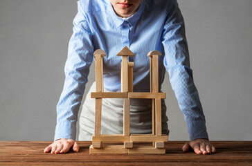 Wall Mural - Business woman building construction on table