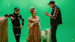 © Gorodenkoff - On Period Costume Drama Film Set: Beautiful Smiling Actress Wearing Renaissance Dress and Actor Wearing Motion Capture Suit Listen to Movie Director Explaining to Her Scene Context.