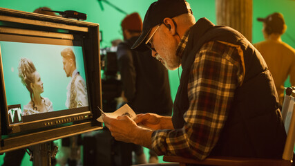 Wall Mural - Director Looks at Display Controls Shooting Period Drama Movie. Green Screen CGI Scene with Actors Wearing Renaissance Costumes. Crew Shooting High Budget Movie.