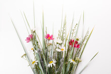 Festive Bouquet Of Pink And Purple, White Wildflowers, Cosmea, Herbs On A White Background
