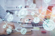 © peshkova - Social network theme hologram with businessman working on computer on background. Concept of world wide web. Multi exposure.